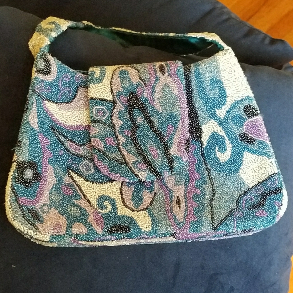 Beaded statement purse with zippers & flap clasp.